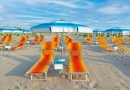 blue-umbrellas-chaise-lounges-beach-rimini-italy